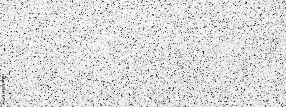 A textured surface featuring a speckled pattern in shades of gray and white. A textured surface featuring a speckled pattern in shades of gray and white.