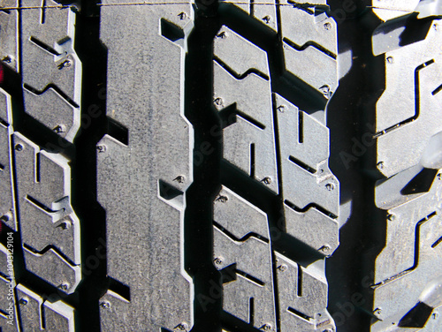 Tire tread pattern background, defines strength, endurance, and flexibility in all situations.