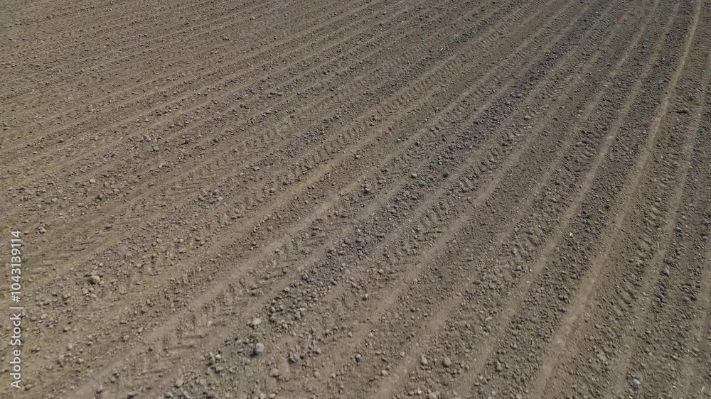 Plowed and processed agricultural field, aerial view, drone view Plowed and processed agricultural field, aerial view, drone view