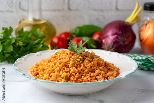 Obraz na płótnie Traditional turkish bulgur pilaf with tomato sause in plate (Turkish name; meyhane pilavi) w salonie