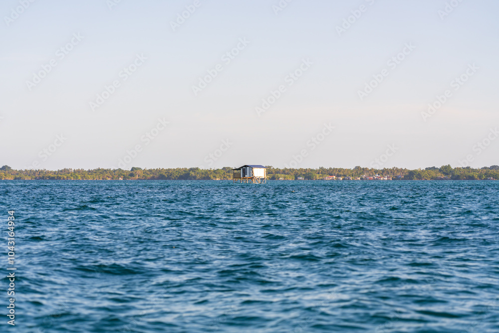 Single Bajau Sea Gypsy Floating Village elevated house on stilts, off the coast of Semporna and Bum Bum Island (Pulau Bum-Bum), Sabah, Malaysia (Borneo)