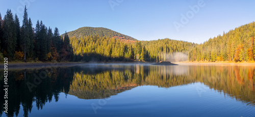 Obraz na płótnie autumn landscape with lake in morning light. beautiful travel destination of europe in carpathian mountains of ukraine w salonie