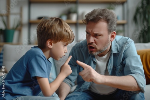 Father calmly addresses son about his behavior during a serious conversation at home in the afternoon