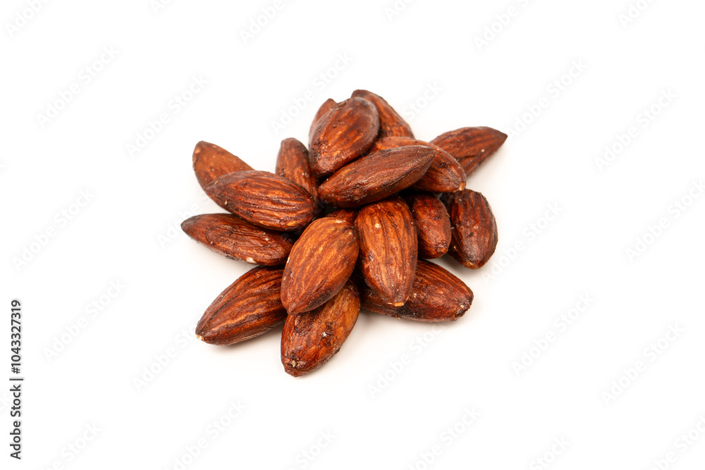 A group of caramelized almonds isolated on a white background. A group of caramelized almonds isolated on a white background.