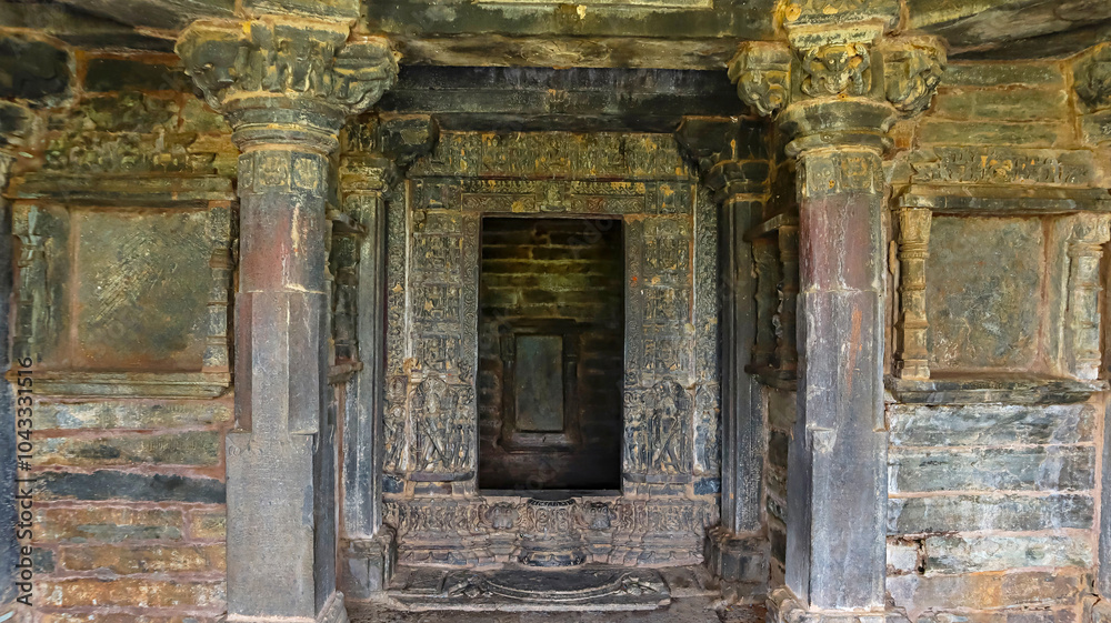 View of the antarala with a carved entrance of Someshwara Mahadev Temple, Arthuna Group of Temples, Banswara, Rajasthan, India. View of the antarala with a carved entrance of Someshwara Mahadev Temple, Arthuna Group of Temples, Banswara, Rajasthan, India.