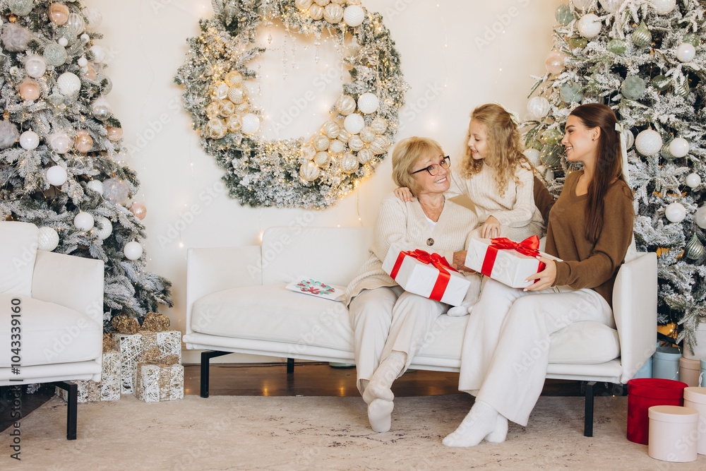 Obraz premium Three Generations Celebrating Christmas Together with Gifts