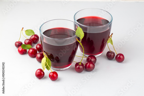 Obraz na płótnie Glass of sour cherry juice with fresh red cherries, summer juice w salonie