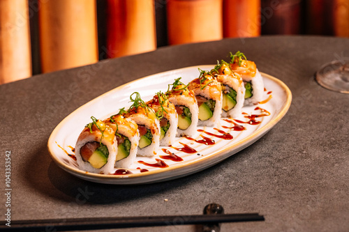 A luxury table features two elegant pieces of sushi. photo