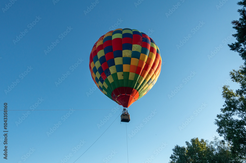 Fototapeta premium Colorful Muticolor hot air balloon floting in the blue sky.