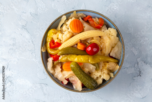 Obraz na płótnie Assorted mixed pickled vegetables in bowl - plate, Turkish name; tursu. w salonie