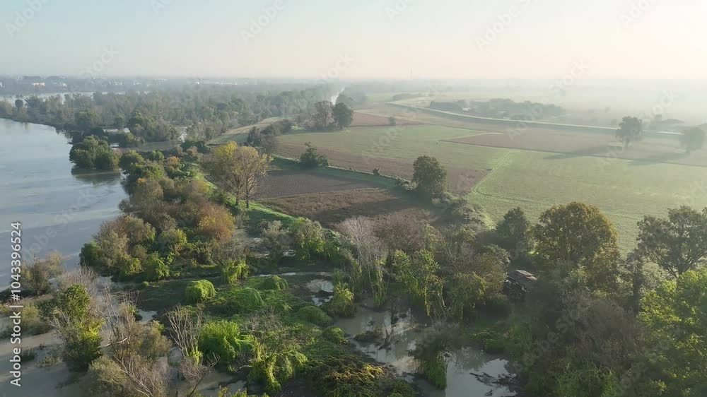 Aerial view of the po river overflowing its banks after intense rainfall flooding surrounding fields Aerial view of the po river overflowing its banks after intense rainfall flooding surrounding fields