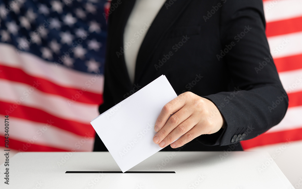 Close-up of voter putting ballot into voting box. Close-up of voter putting ballot into voting box.