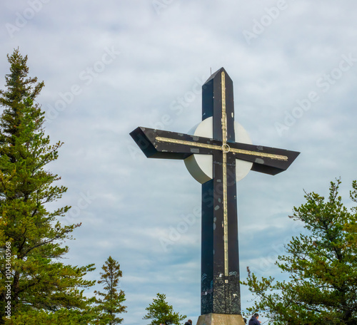 Cross marking the highest point of the famous Eucher hiking trail (Sentier Eucher), La Baie, Saguenay Fjord, Quebec, Canada