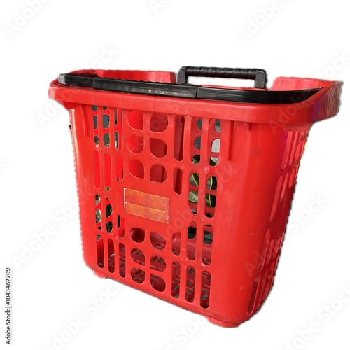 Empty red plastic shopping basket cart for groceries with trolley wheels isolated on white background