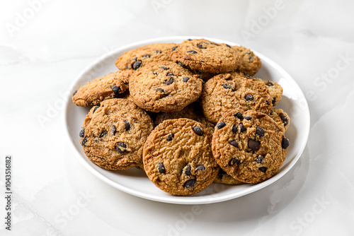 Bild auf Leinwand chocolate chip cookies on a white plate