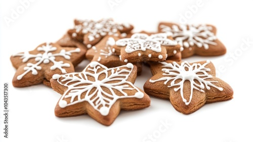 Christmas gingerbread stars with intricate white icing details, isolated on white background