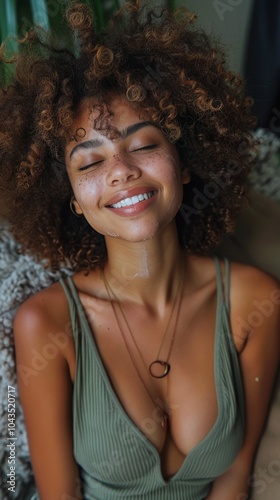 Smiling Woman With Curly Hair in Tank Top