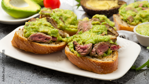 Toasted ciabatta with grilled beef and guacamole.