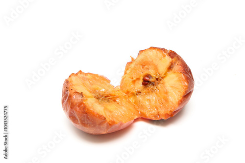 A picture of the fallen down and rotten apple. Starting to ferment and beginning to be moldy. 