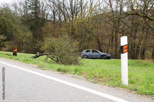 Abandoned car standing by the road after the traffic accident. Completely destroyed and wrecked.  