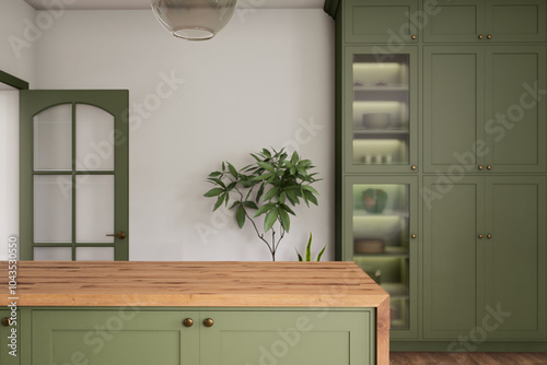 A modern kitchen design featuring beautiful green cabinets paired with a rustic countertop