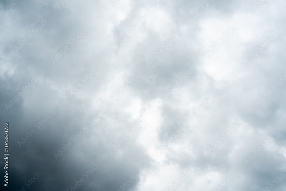 Fototapeta premium Dark dramatic storm cumulus clouds in autumn. An impending storm, hurricane or thunderstorm. Bad weather.