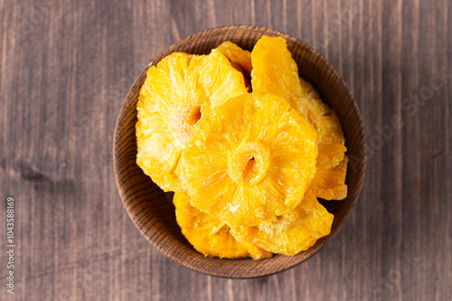 Dried pineapple in a bowl. Dried fruits. 