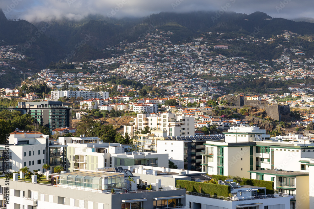 View of the cityscape and rooftops of Funchal city. Madeira Island, Portugal View of the cityscape and rooftops of Funchal city. Madeira Island, Portugal