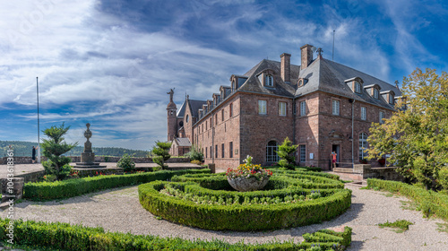 Mont Sainte Odile, France - 09 07 2024: Alsatian Vineyard. Panoramic view of the courtyard and facade of the Sanctuary of Mont Sainte Odile along the wine route. photo