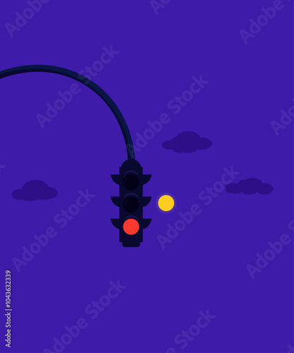 traffic lights at night with moon in the background.