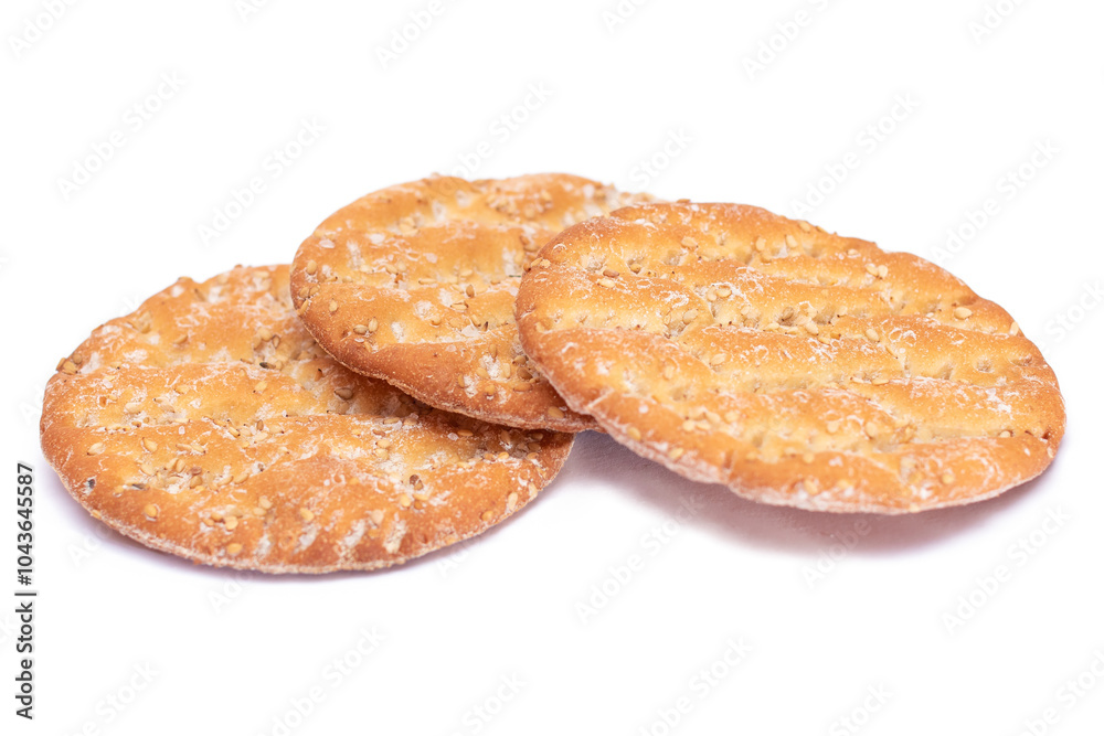 A Heap of Round Salt Crackers with Sesame Isolated on White Background. Dry Snacks - Isolation A Heap of Round Salt Crackers with Sesame Isolated on White Background. Dry Snacks - Isolation