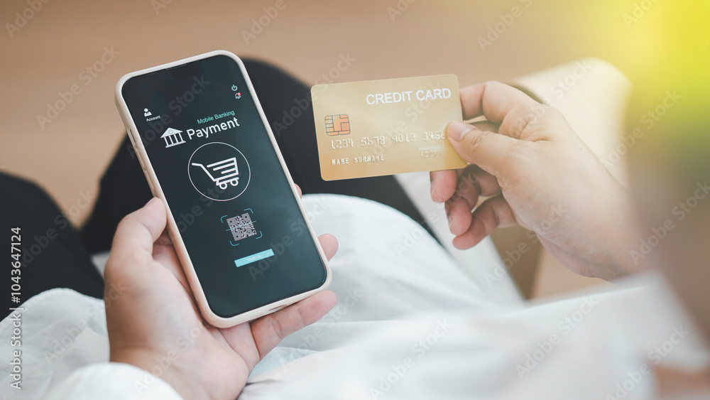 close up woman using her smartphone and her credit card at home. Online shopping, paying online, using banking service, entering information, shopping, ordering in internet store, secure payment.