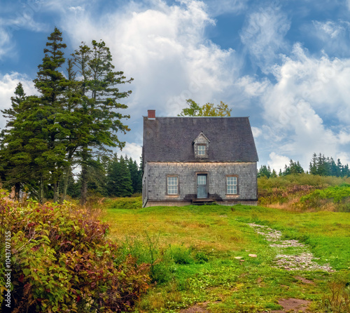 Ruins of old farm houses scattered around Bonaventure Island National Park, Percé, Gaspésie peninsula, Quebec, Canada photo