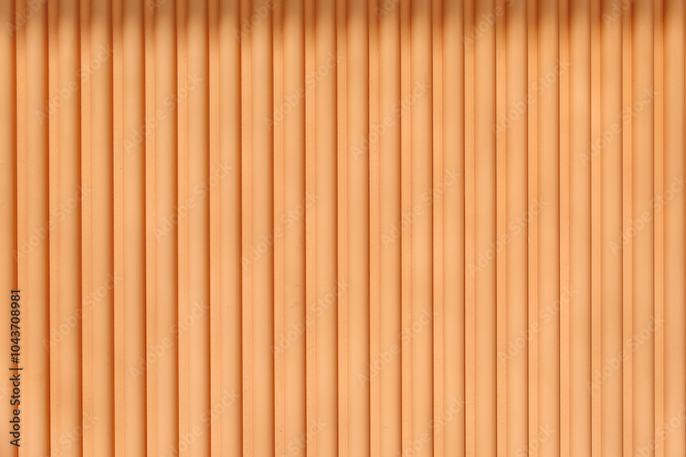 Soft orange-striped wall with vertical lines in a modern interior design setting Soft orange-striped wall with vertical lines in a modern interior design setting
