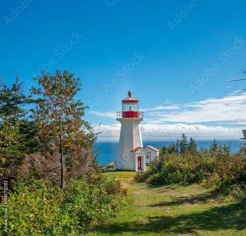 Cap Gaspé lighthouse at the End of Les Graves Trail, the northern terminus for the International Appalachian Trail, Forillon National Park, Gaspé, Gaspésie, Quebec, Canada photo