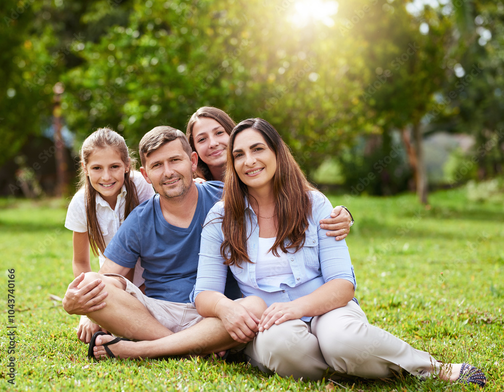 Fototapeta premium Parents, kids and smile in portrait at park for holiday, relax and relationship with love in nature. Happy family, people and girl children on grass for weekend together, safety and support with care