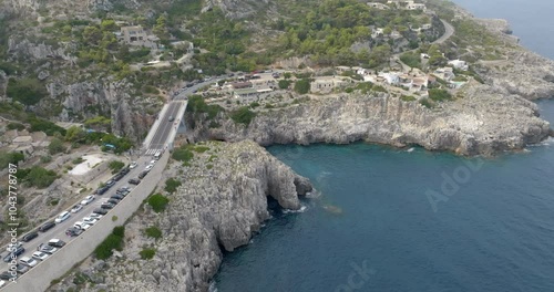 Aerial view of Ciolo's Bridge in the province of Lecce, Salento, Puglia, Italy. It is a single-span bridge and crosses a inlet. It overlooks the Mediterranean Sea. photo