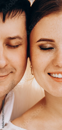 Wedding portrait of the bride and groom with beautiful facial features, half face photo, love