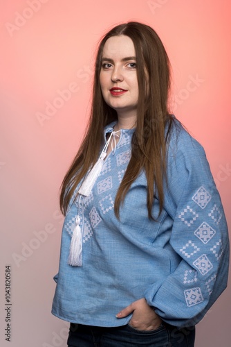 Female portrait in traditional attire on a red backdrop. The contrast highlights Ukrainian heritage and modern fashion, ideal for cultural or promotional content