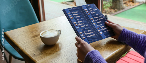 Woman with menu and cup of ...