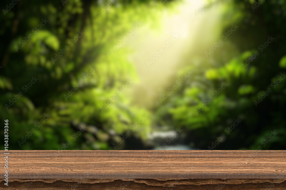 Dark wood table top with blur on green palm leaves or tree in tropical forest with bokeh light at background - Using for Mock up template for display of your design,Banner for advertise of product. Dark wood table top with blur on green palm leaves or tree in tropical forest with bokeh light at background - Using for Mock up template for display of your design,Banner for advertise of product.
