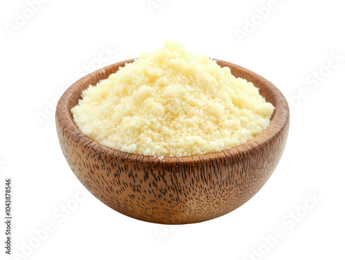 Wooden bowl filled with fine, yellow cheese powder isolated on a white background.