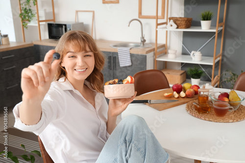 Woman with tasty oatmeal in...