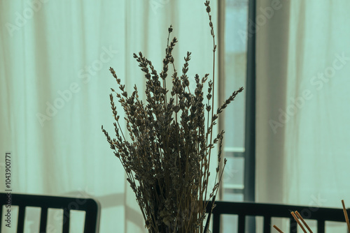 bunch og dry lavender in house as home decoration and room scent, daylight through white linen curtains, cozy soft colors home photo