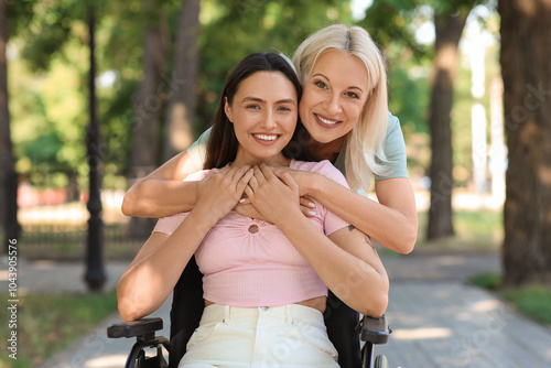 Young woman in wheelchair a...