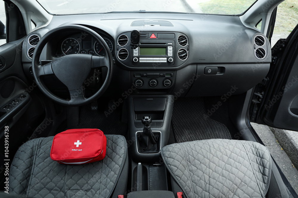Fototapeta premium First aid kit on car seat