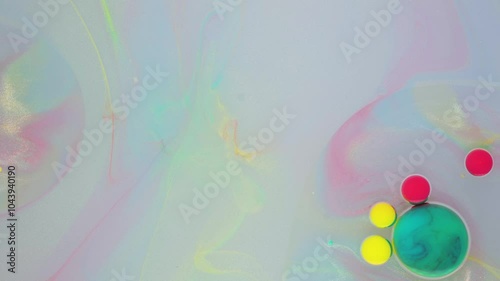 Creating colorful bubble art using soap, water, and vibrant dyes in a playful indoor setting