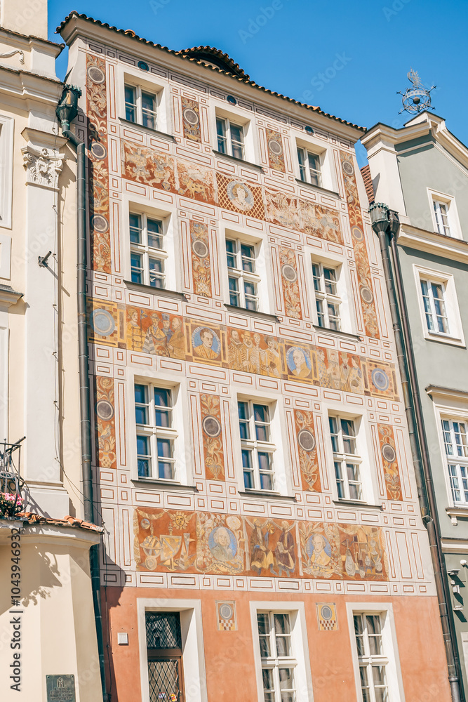 Colorful Historic Buildings and Houses on Stary Rynek Square in Poznań, Poland, with a Blue Sky and Mural Art