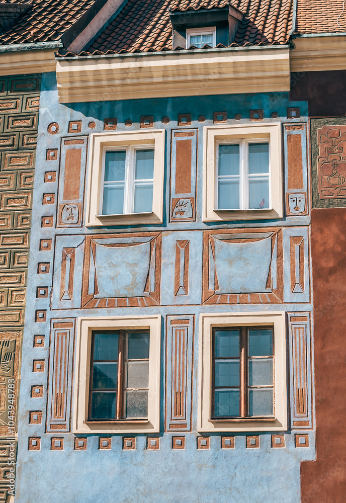 Colorful Historic Buildings and Houses on Stary Rynek Square in Poznań, Poland, with a Blue Sky and Mural Art