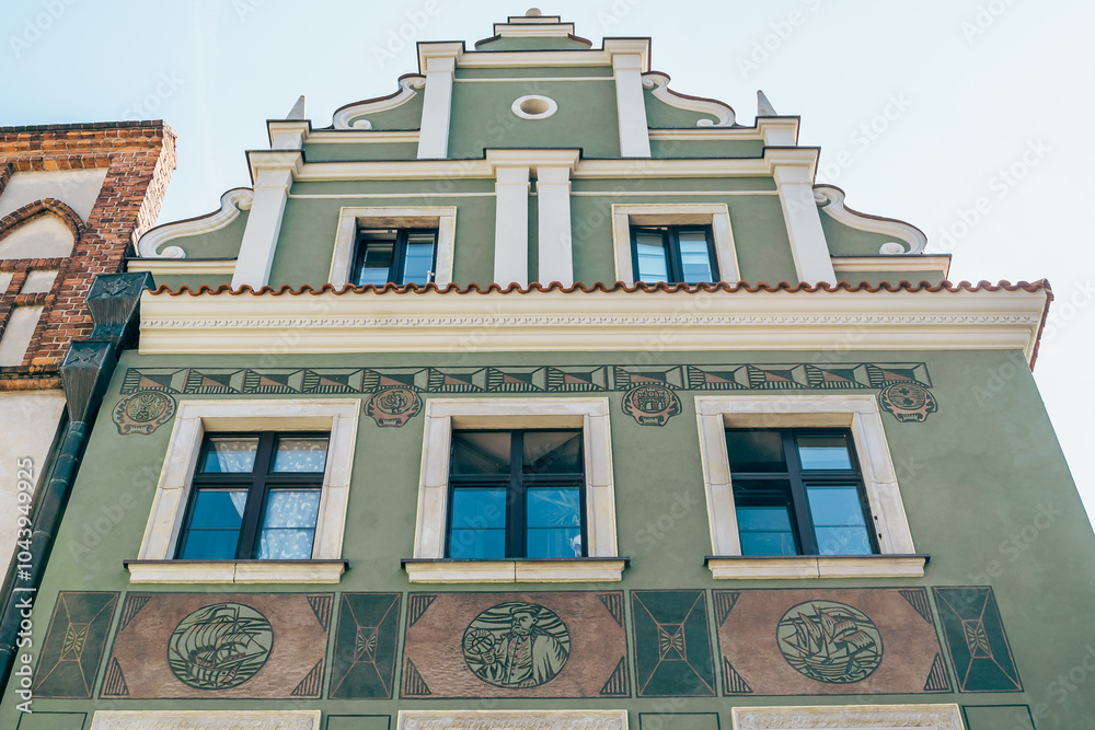 Colorful Historic Buildings and Houses on Stary Rynek Square in Poznań, Poland, with a Blue Sky and Mural Art